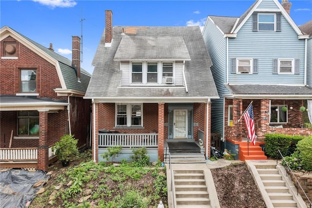 1860 Jancey St, Morningside, PA 15206 - view of front of property featuring covered porch, a chimney, and brick siding