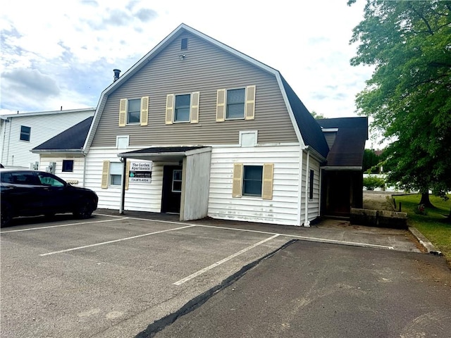 230 E Water St, Slippery Rock Boro, PA 16057 - view of front facade with a gambrel roof and uncovered parking