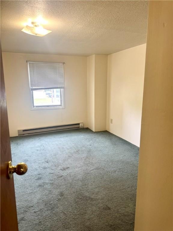230 E Water St, Slippery Rock Boro, PA 16057 - unfurnished room with a baseboard radiator, carpet, and a textured ceiling