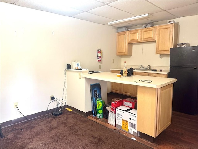 230 E Water St, Slippery Rock Boro, PA 16057 - kitchen with freestanding refrigerator, a paneled ceiling, light brown cabinets, light countertops, and a peninsula