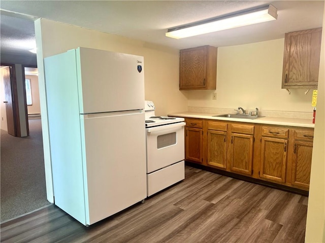 230 E Water St, Slippery Rock Boro, PA 16057 - kitchen with white appliances, dark wood-type flooring, brown cabinetry, and light countertops