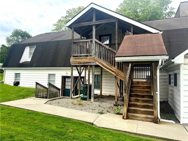 230 E Water St, Slippery Rock Boro, PA 16057 - back of property with stairs, a yard, and a deck