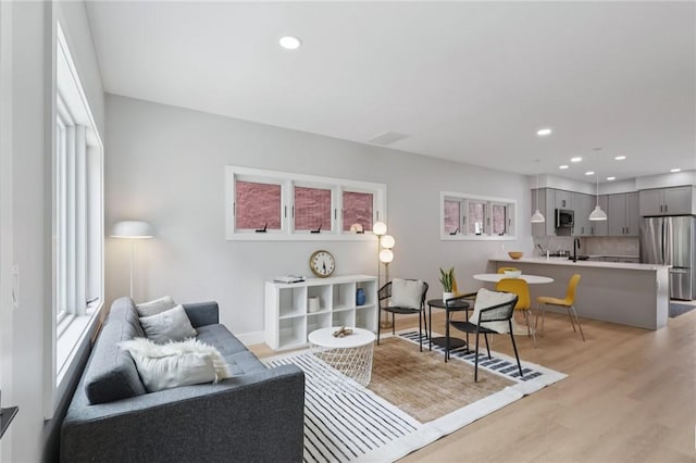 1211 Boyle St, Central North Side, PA 15212 - living area with light wood-style flooring, plenty of natural light, and recessed lighting