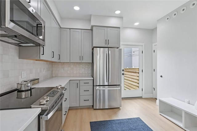 1211 Boyle St, Central North Side, PA 15212 - kitchen with stainless steel appliances, gray cabinets, light wood-style flooring, light countertops, and recessed lighting