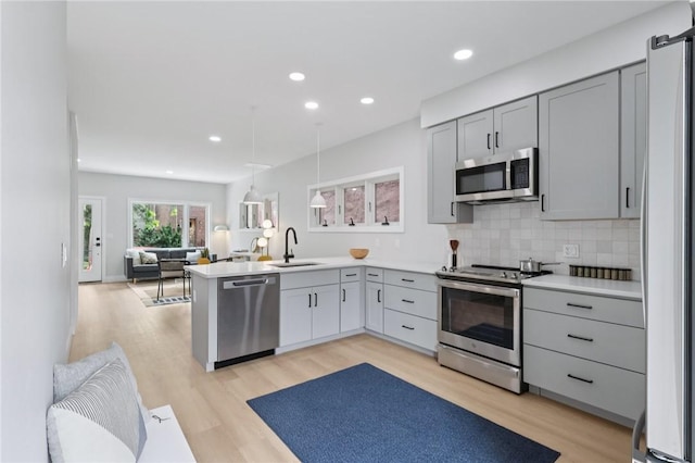 1211 Boyle St, Central North Side, PA 15212 - kitchen featuring stainless steel appliances, open floor plan, gray cabinets, light wood-style floors, and recessed lighting