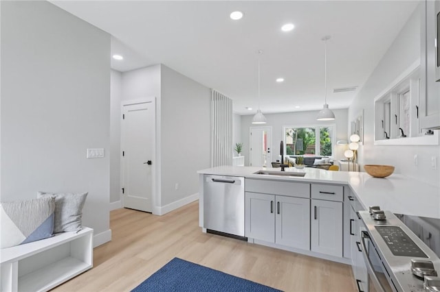1211 Boyle St, Central North Side, PA 15212 - kitchen with dishwasher, a peninsula, light wood-style floors, decorative light fixtures, and recessed lighting