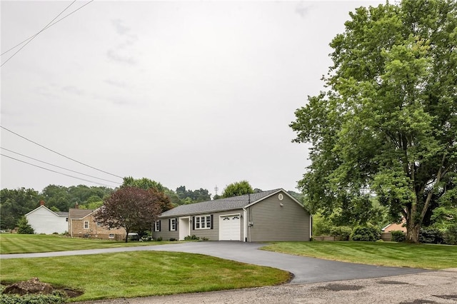 2899 E Elfinwild Rd, Hampton, PA 15101 - single story home with an attached garage, asphalt driveway, and a front lawn