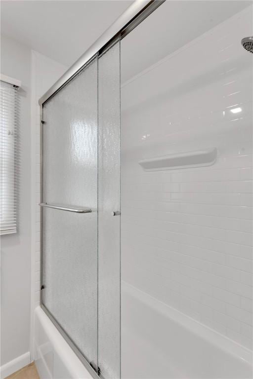 2899 E Elfinwild Rd, Hampton, PA 15101 - bathroom featuring shower / bath combination with glass door and baseboards
