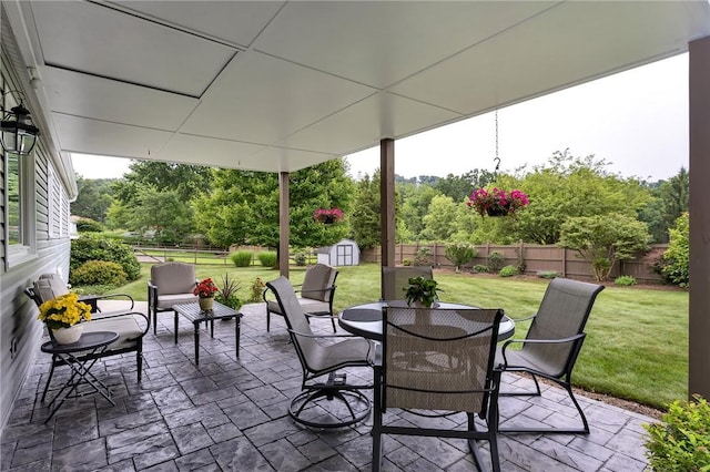 2899 E Elfinwild Rd, Hampton, PA 15101 - fenced backyard with a storage shed, a patio, and outdoor dining space