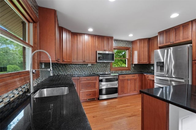 362 Ridge Rdg, Jackson Twp, PA 16063 - kitchen featuring stainless steel appliances, tasteful backsplash, light wood finished floors, dark stone countertops, and recessed lighting