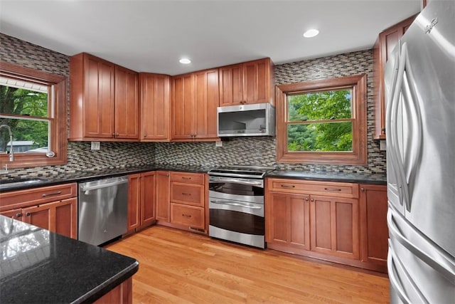 362 Ridge Rdg, Jackson Twp, PA 16063 - kitchen featuring stainless steel appliances, backsplash, light wood-type flooring, brown cabinets, and recessed lighting