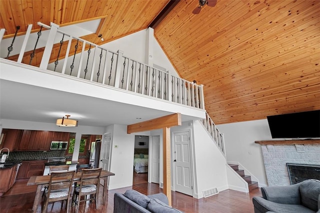 362 Ridge Rdg, Jackson Twp, PA 16063 - living room with a wood ceiling with exposed beams, stairway, dark wood-style floors, a brick fireplace, and high vaulted ceiling