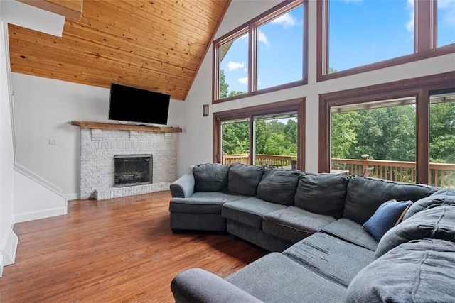362 Ridge Rdg, Jackson Twp, PA 16063 - living area featuring high vaulted ceiling, wood ceiling, wood finished floors, healthy amount of natural light, and a brick fireplace