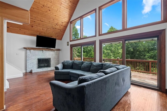 362 Ridge Rdg, Jackson Twp, PA 16063 - living room featuring high vaulted ceiling, wooden ceiling, healthy amount of natural light, wood finished floors, and a stone fireplace