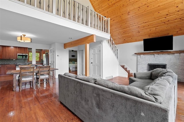 362 Ridge Rdg, Jackson Twp, PA 16063 - living area with stairway, dark wood finished floors, a fireplace, high vaulted ceiling, and wooden ceiling