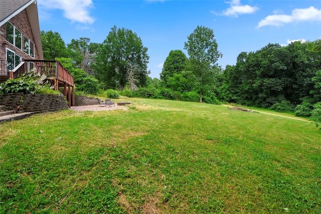 362 Ridge Rdg, Jackson Twp, PA 16063 - view of green lawn featuring an outdoor fire pit, a deck, and a patio area