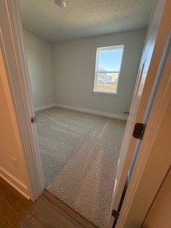 326 Stately Ct, Adams Twp, PA 16046 - carpeted empty room with baseboards and a textured ceiling