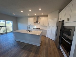 326 Stately Ct, Adams Twp, PA 16046 - kitchen with wall chimney exhaust hood, appliances with stainless steel finishes, dark wood-style flooring, recessed lighting, and white cabinetry