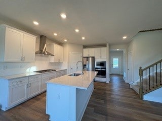 326 Stately Ct, Adams Twp, PA 16046 - kitchen with wall chimney range hood, appliances with stainless steel finishes, dark wood-style flooring, recessed lighting, and white cabinets