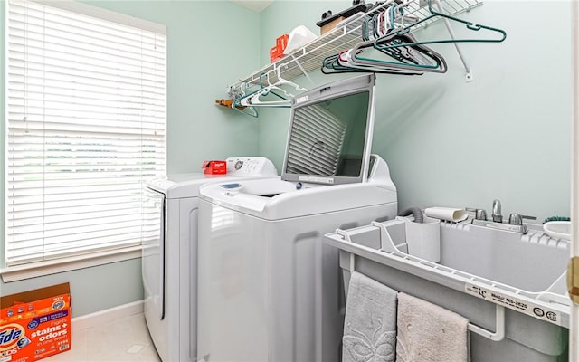 489 Jenny Dr, Richland, PA 15044 - laundry area with washing machine and dryer, plenty of natural light, and light tile patterned floors