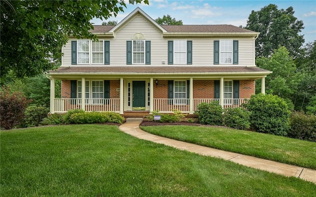 489 Jenny Dr, Richland, PA 15044 - view of front facade featuring brick siding, a porch, and a front lawn