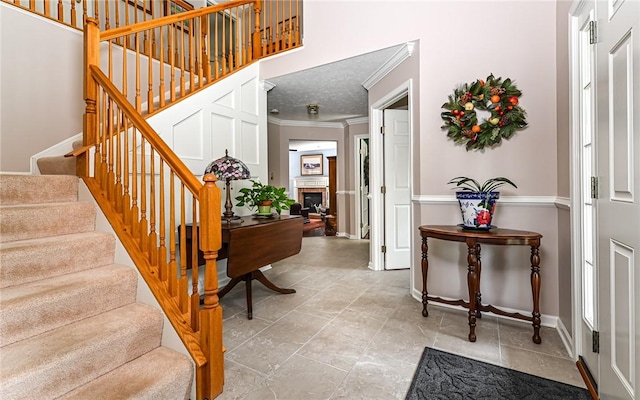 489 Jenny Dr, Richland, PA 15044 - entrance foyer featuring ornamental molding, stairway, and a fireplace