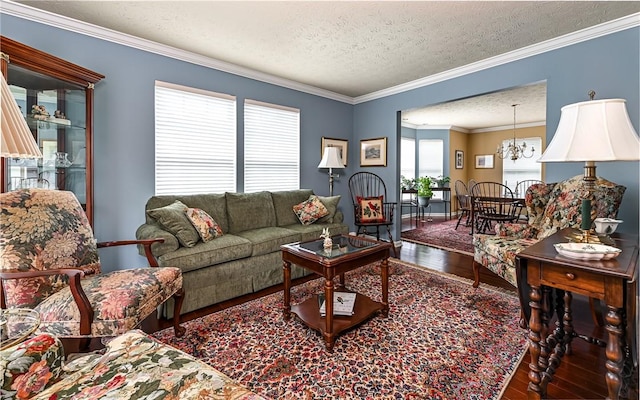 489 Jenny Dr, Richland, PA 15044 - living area with wood finished floors, a textured ceiling, crown molding, and a chandelier