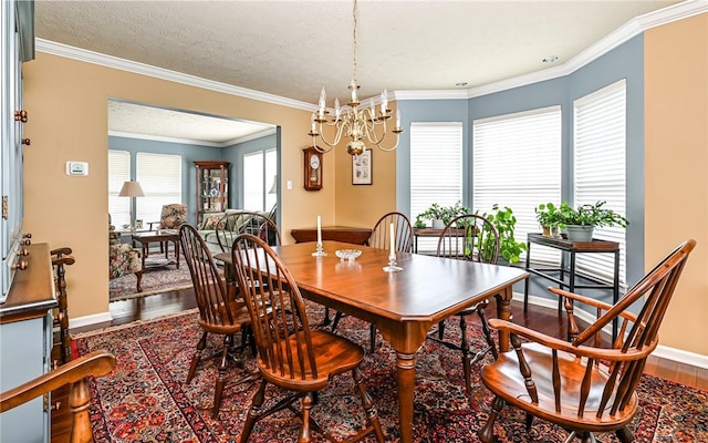 489 Jenny Dr, Richland, PA 15044 - dining room featuring wood finished floors, a chandelier, crown molding, and a textured ceiling