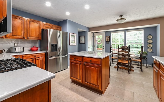 489 Jenny Dr, Richland, PA 15044 - kitchen featuring stainless steel refrigerator with ice dispenser, light countertops, backsplash, brown cabinets, and a textured ceiling