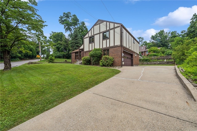 982 Braddock Rd, Forest Hills Boro, PA 15221 - view of side of home featuring driveway, an attached garage, brick siding, a yard, and stucco siding