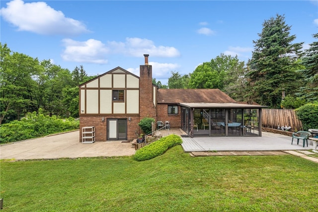 982 Braddock Rd, Forest Hills Boro, PA 15221 - rear view of property with a sunroom, a patio area, a chimney, brick siding, and stucco siding