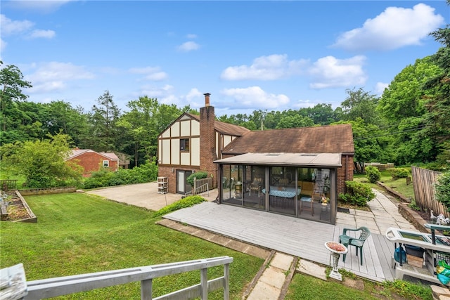 982 Braddock Rd, Forest Hills Boro, PA 15221 - rear view of property featuring a deck, a sunroom, a chimney, and brick siding