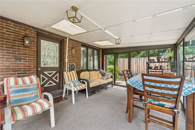 982 Braddock Rd, Forest Hills Boro, PA 15221 - sunroom with brick wall and carpet flooring