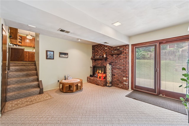 982 Braddock Rd, Forest Hills Boro, PA 15221 - living room with carpet, a brick fireplace, and stairway