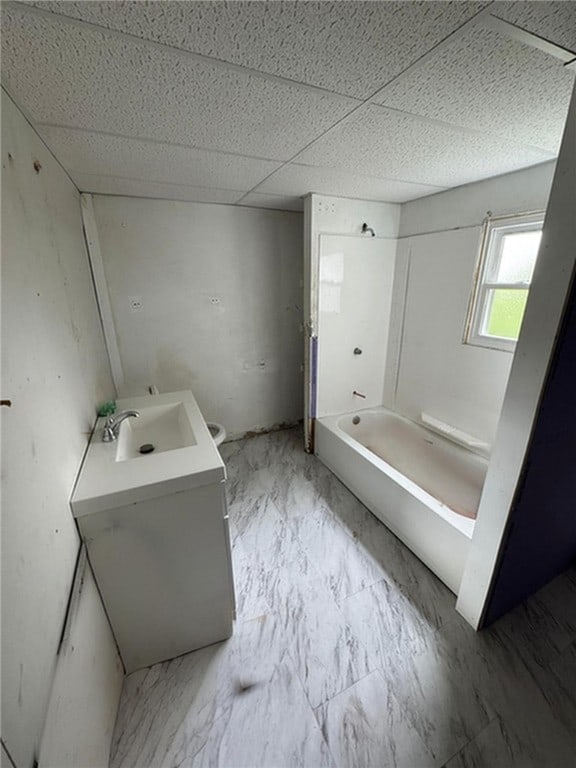21 Hodgson Ave, Ingram, PA 15205 - bathroom with marble look tile flooring, vanity, and a paneled ceiling