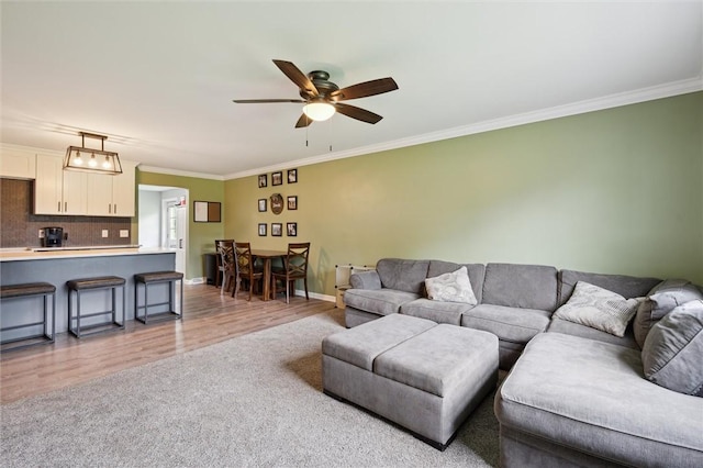 4 Ward St, Canton Twp, PA 15301 - living area with ornamental molding, a ceiling fan, light wood-style floors, and light carpet