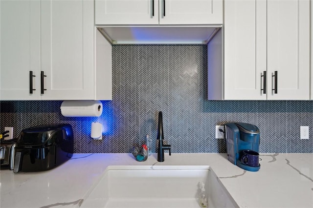 4 Ward St, Canton Twp, PA 15301 - kitchen featuring tasteful backsplash, white cabinets, and light stone counters