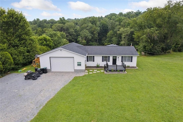 4 Ward St, Canton Twp, PA 15301 - single story home featuring a wooded view, a front lawn, gravel driveway, and an attached garage