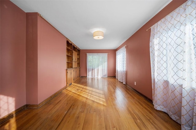 7604 Tyler Rd, Verona, PA 15147 - spare room featuring light wood finished floors and built in features