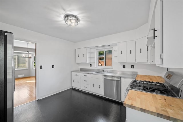 7604 Tyler Rd, Verona, PA 15147 - kitchen featuring appliances with stainless steel finishes, wood counters, open shelves, white cabinets, and a chandelier
