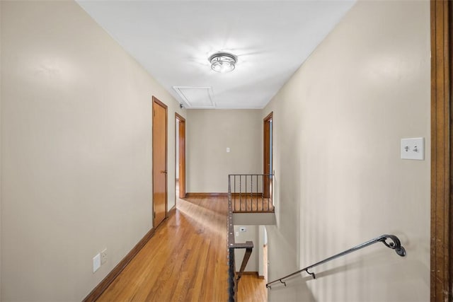 7604 Tyler Rd, Verona, PA 15147 - corridor featuring an upstairs landing, light wood-type flooring, and attic access