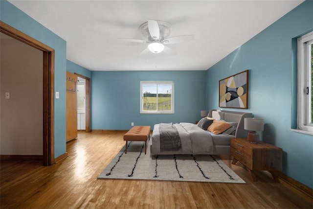 7604 Tyler Rd, Verona, PA 15147 - bedroom with multiple windows, wood finished floors, and a ceiling fan