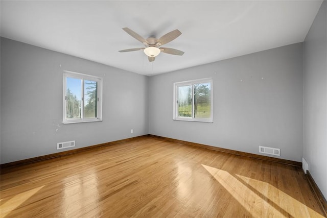 7604 Tyler Rd, Verona, PA 15147 - unfurnished room with healthy amount of natural light, light wood-style floors, and a ceiling fan