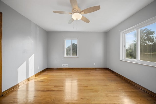 7604 Tyler Rd, Verona, PA 15147 - empty room featuring plenty of natural light and light wood finished floors