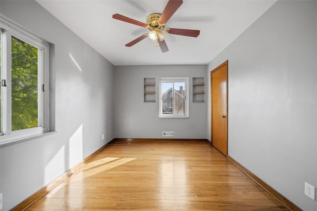 7604 Tyler Rd, Verona, PA 15147 - spare room with healthy amount of natural light, light wood finished floors, and ceiling fan