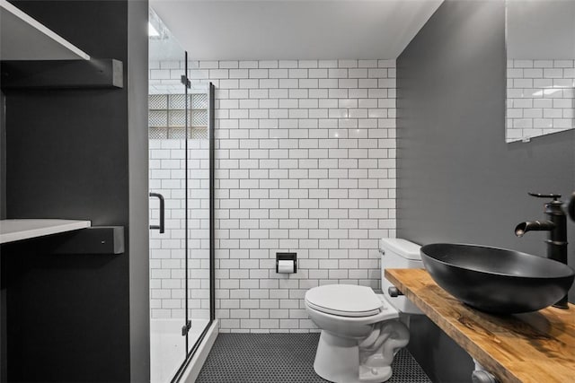 7604 Tyler Rd, Verona, PA 15147 - bathroom featuring a stall shower, tile walls, and tile patterned flooring