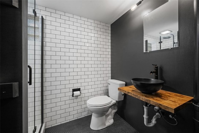 7604 Tyler Rd, Verona, PA 15147 - bathroom with a stall shower, tile patterned flooring, and tile walls