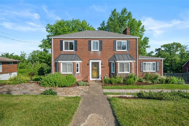 7604 Tyler Rd, Verona, PA 15147 - colonial inspired home featuring a chimney and brick siding