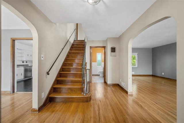 7604 Tyler Rd, Verona, PA 15147 - staircase featuring wood finished floors and arched walkways