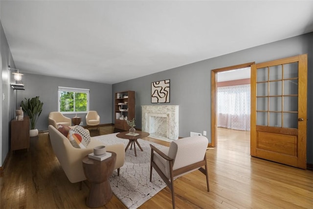 7604 Tyler Rd, Verona, PA 15147 - living area with light wood finished floors and a fireplace